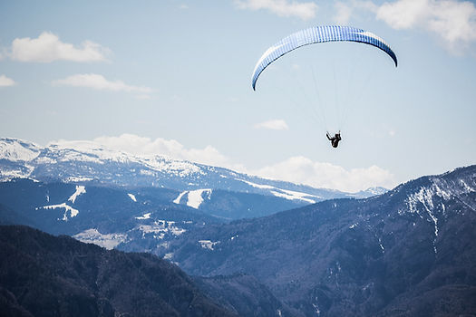 Paraglider Over Mountains