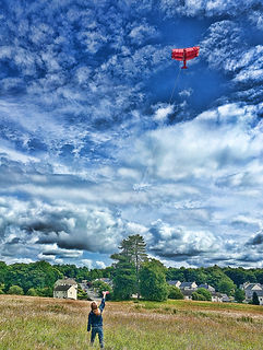 Flying a kite in the Kilmacolm Meadow