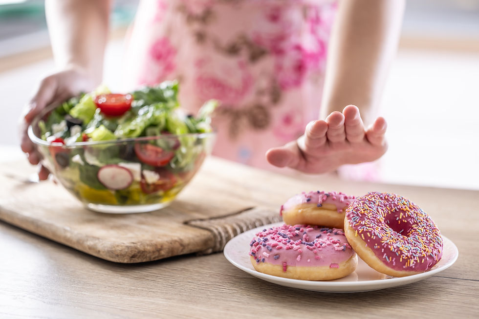 Choosing health: opting for a fresh salad over sugary donuts.