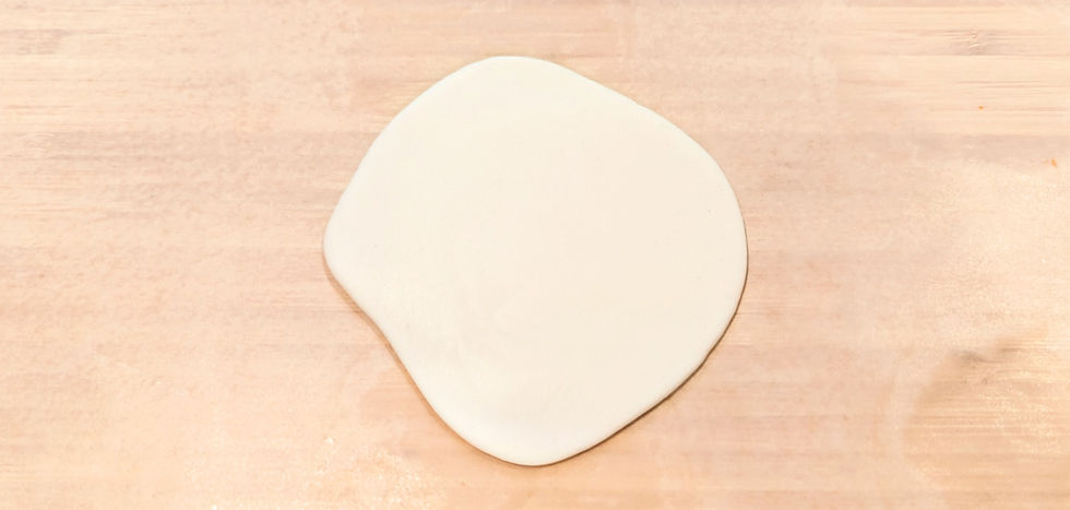 A piece of white fondant rolled out flat.