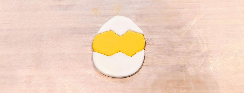 3 individual fondant pieces combined together to create a single shape.