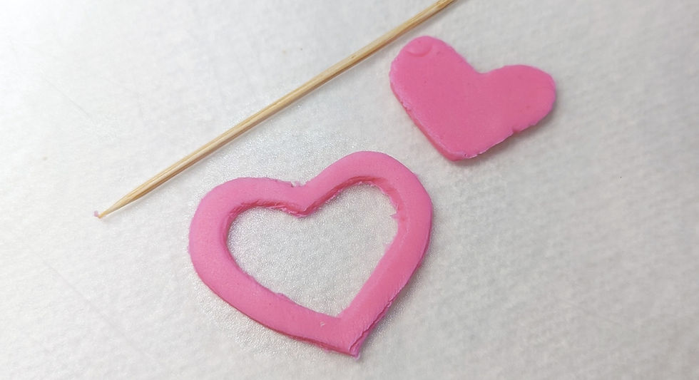 pink heart cutouts made of fondant.