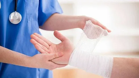 Medical professional expertly cleaning a wound, illustrating professional emergency wound care.