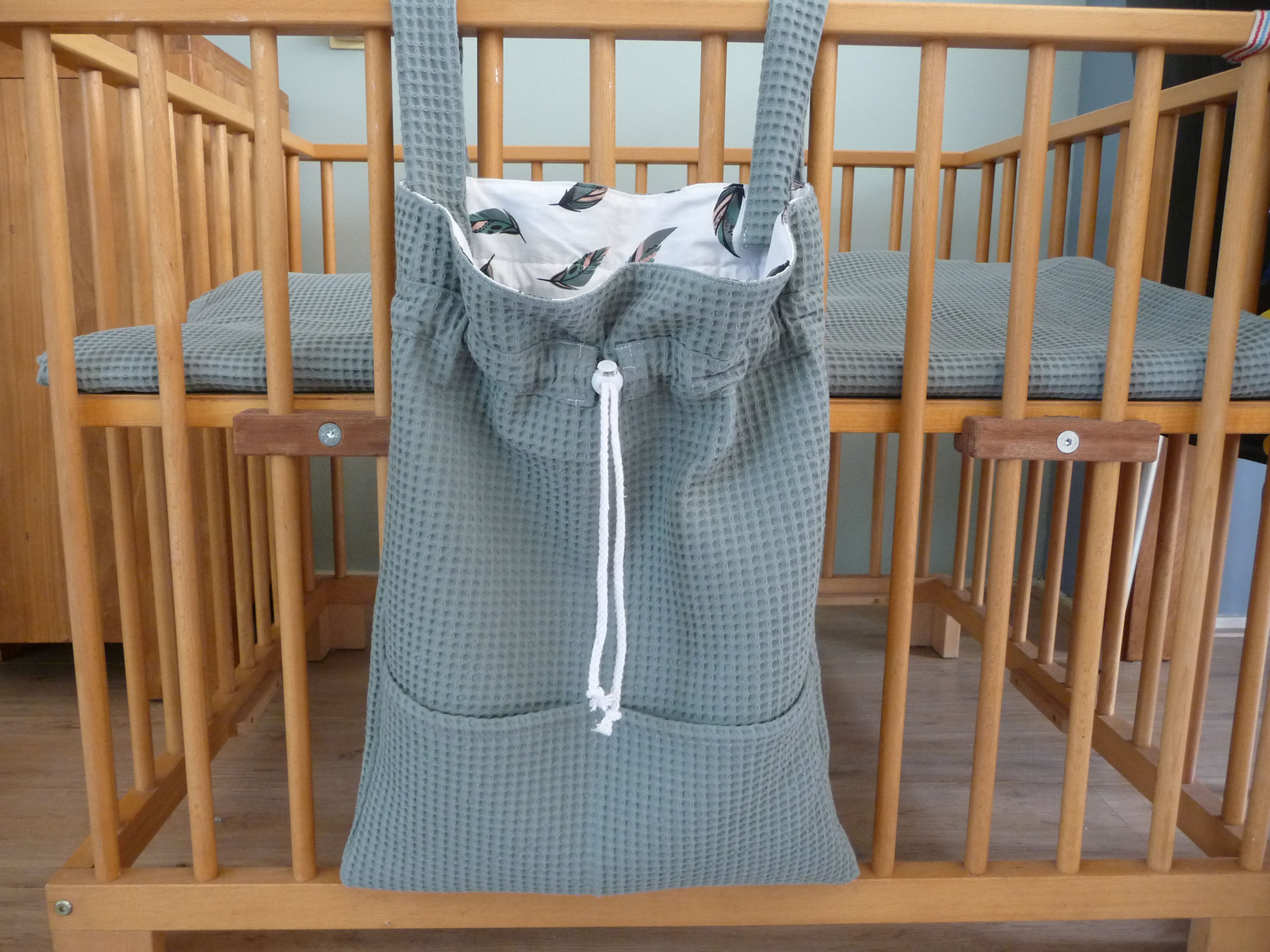 Saffiergroene boxzak gevoerd met print gekleurde veren