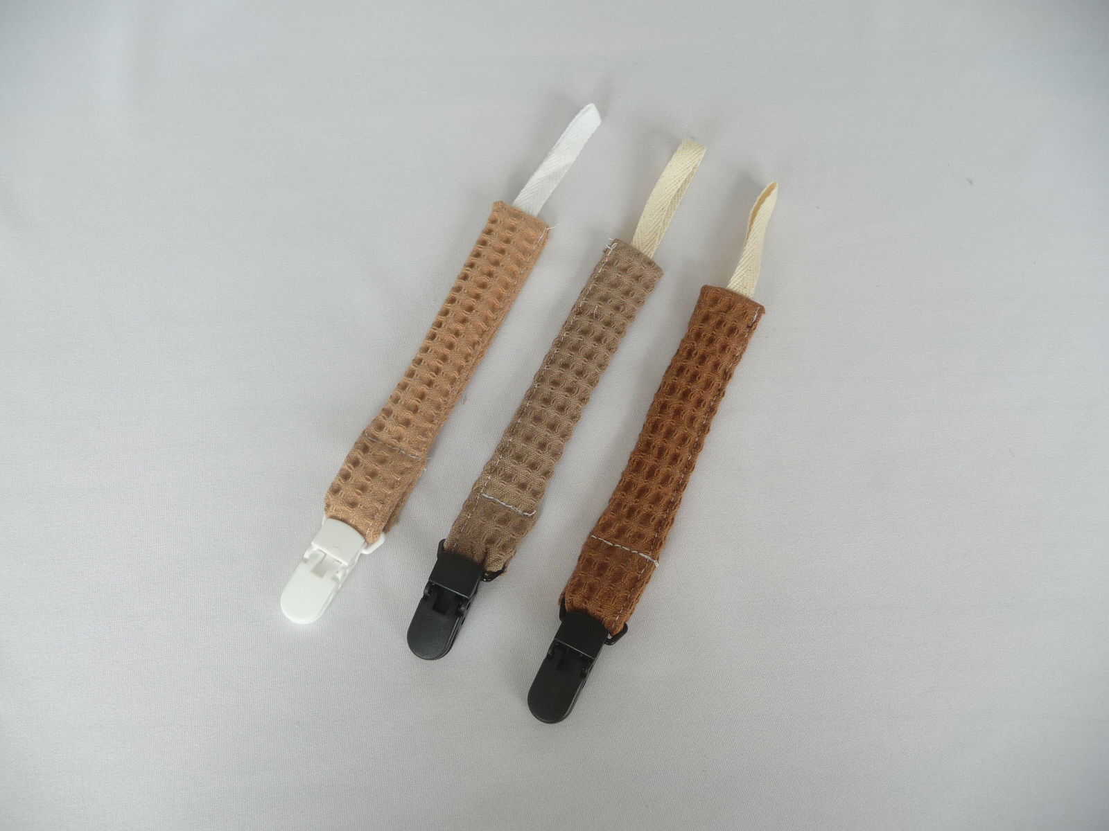 Speenkoorden van wafelstof in camel, taupe en hazelnootkleur