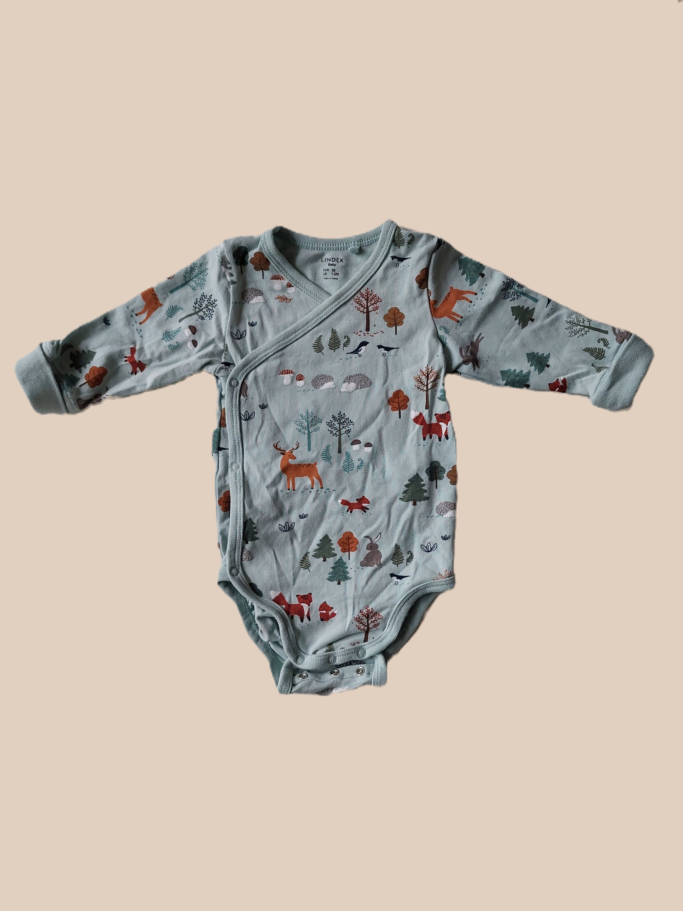 Blå body med skogsdyr