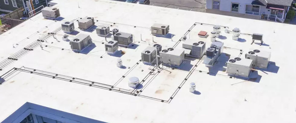 Close-up view of a flat roof showing TPO and EPDM roofing membranes side by side