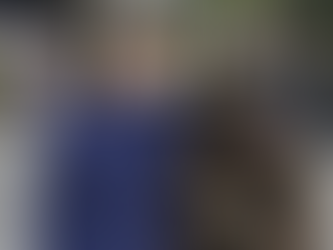 A Boy smiling with silhouette of a girl