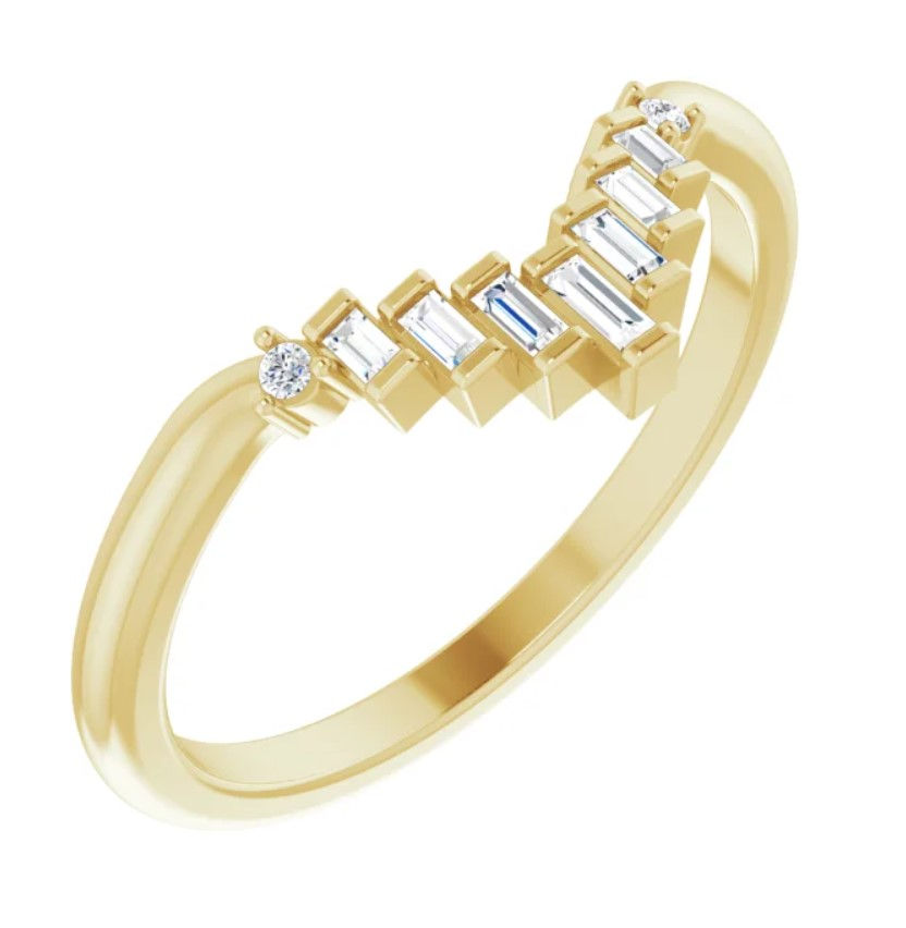 Yellow gold V-shaped diamond band with baguette and round diamonds in a modern geometric design.