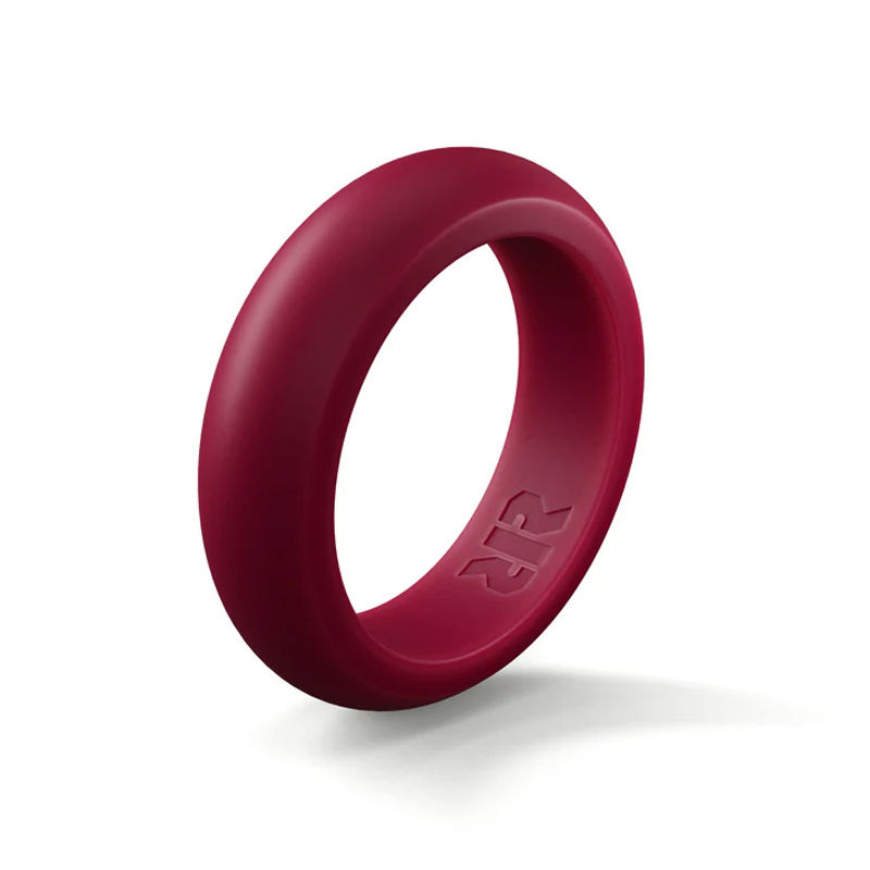A vibrant red silicone ring with a smooth, rounded design and subtle engraved logo detail.