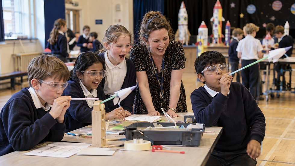 Children enjoying space activities in a school hall