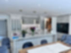 a large white kitchen with modern appliances