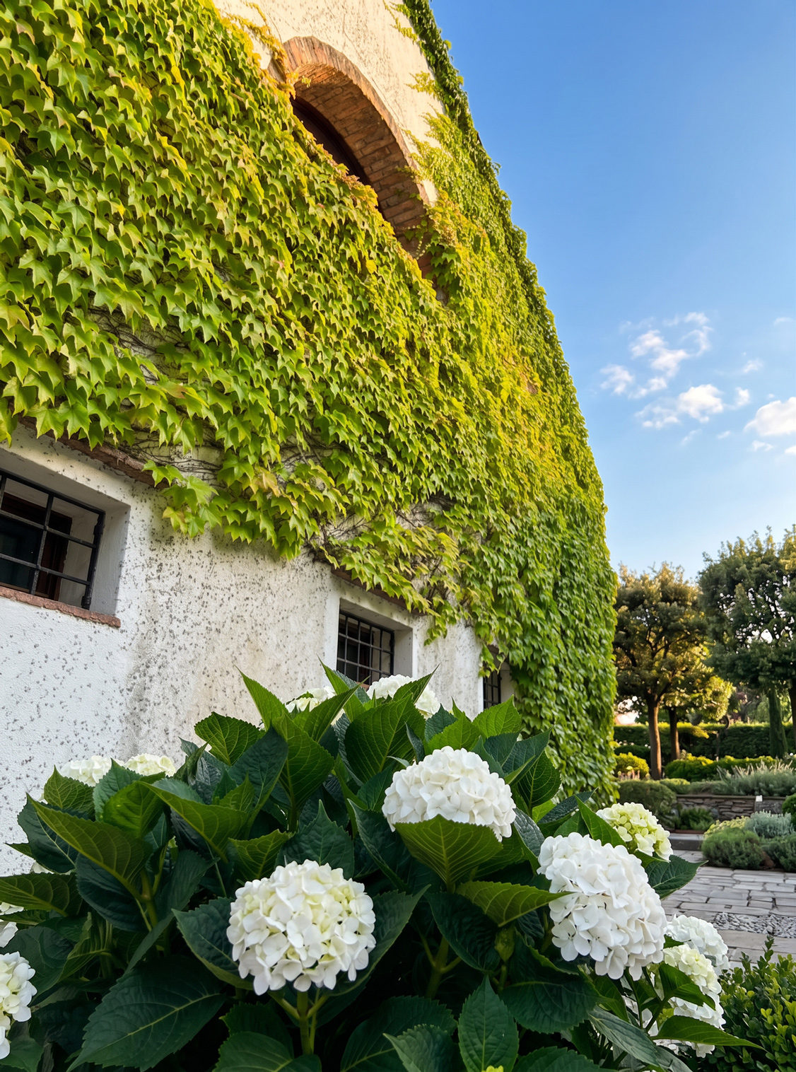 Private country estate garden with orchard, rose beds and mature planting