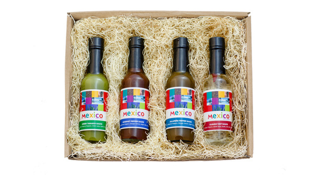 Panola's custom Gourmet Git Box, containing Panola's Gourmet Pepper Sauce, Red Tabasco Hot Sauce, Clearly Hot Sauce, and Jalapeno Hot Sauce.