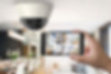 Home Security Systems | IQ Automation + Design | Toronto | Security camera and iphone with remote access viewing
