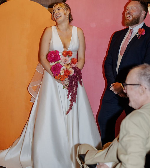 bride with sunset coloured bouquet