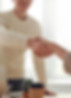 Riley Brosnahan in a meeting with a client shaking hands