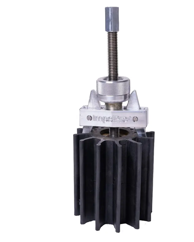 ImpelPro Large impeller puller gripping a large black flexible-vane rubber impeller — bearing-driven extraction on a heavy-du