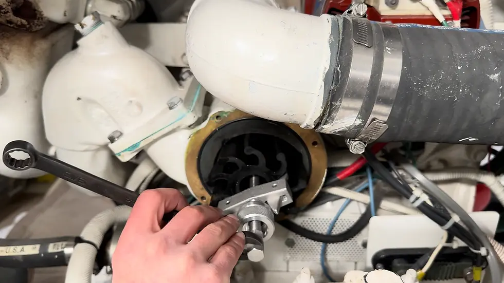 ImpelPro impeller puller winding out a Detroit Diesel water pump impeller with a 9/16 inch wrench, partially removed