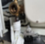 Water pump housing shown empty after impeller removal, highlighting areas to check for grooves or scoring during maintenance.