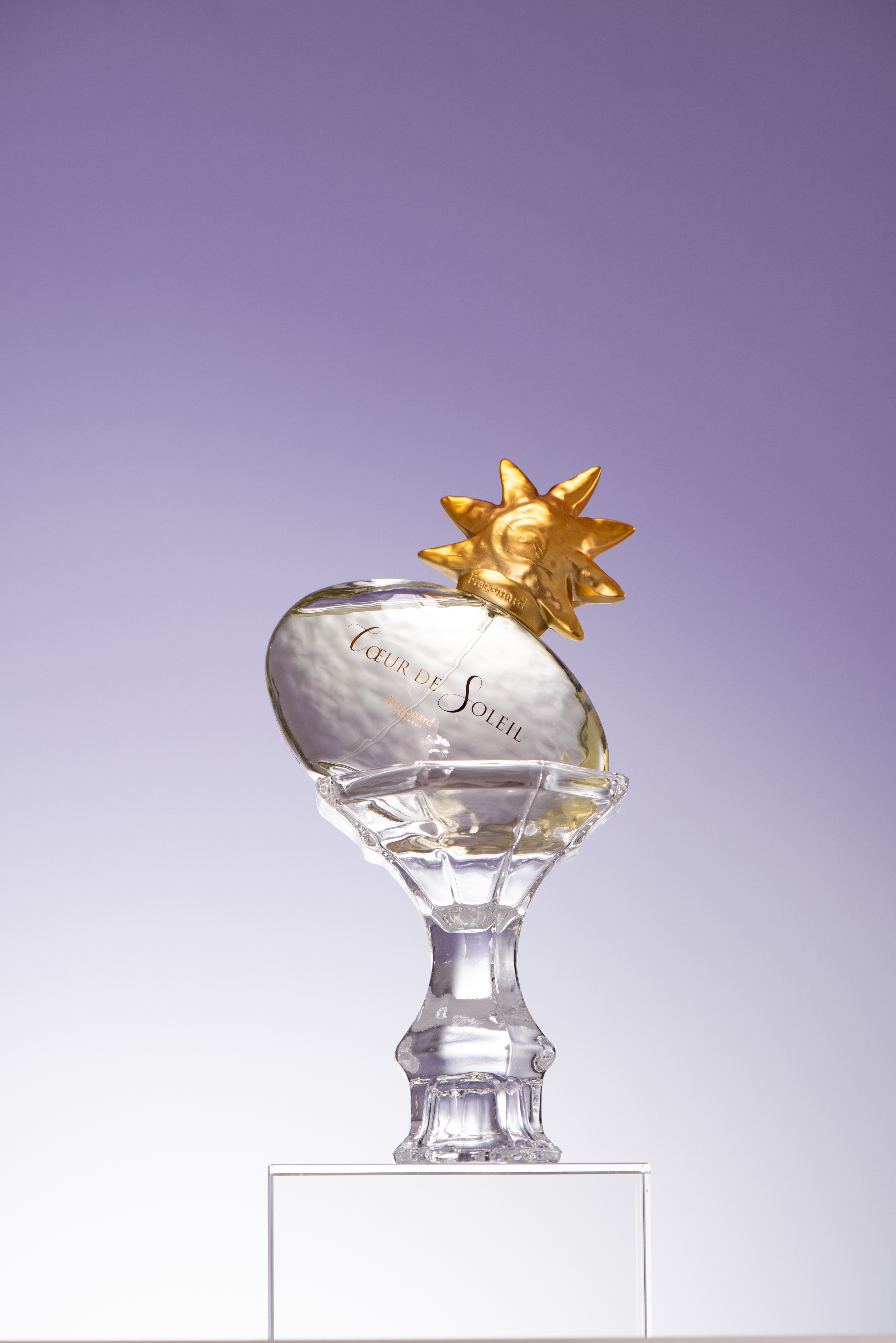 Coeur de Soleil perfume bottle with gold flower cap