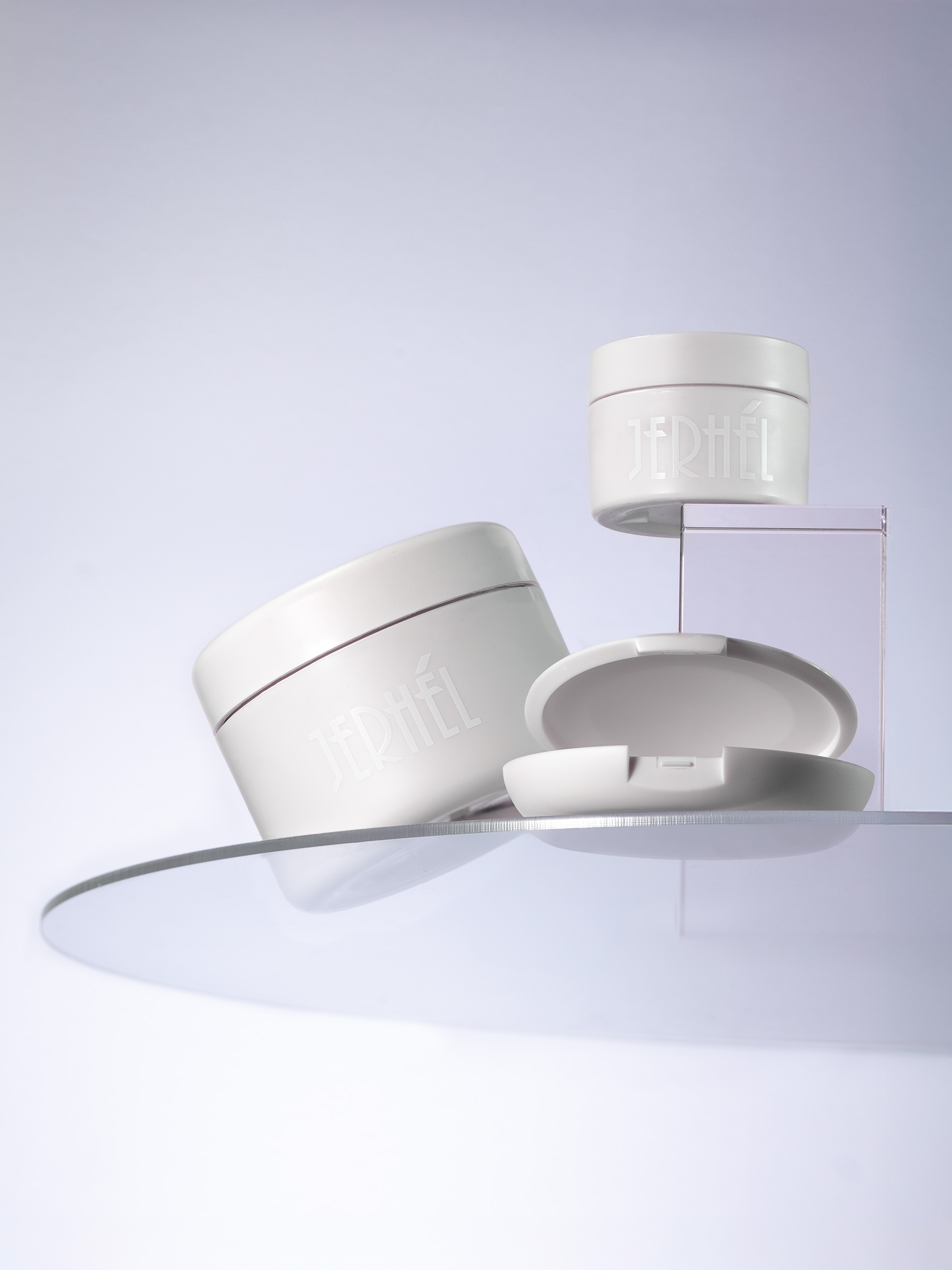 Jerhel jars styled on curved white platforms