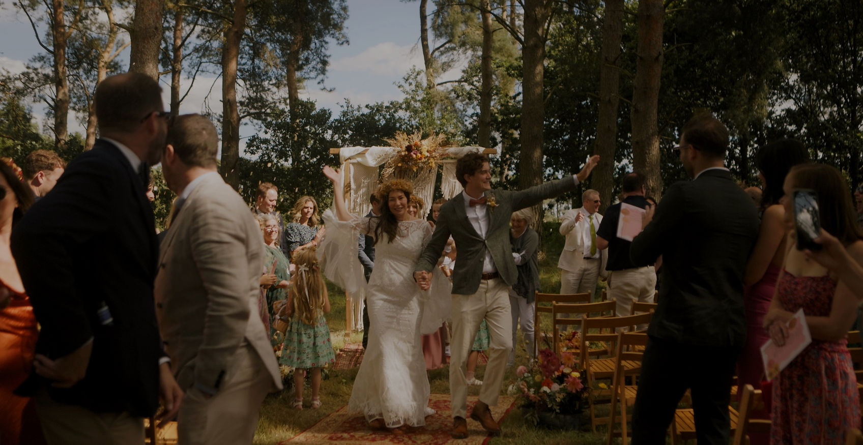 A married couple walking down the aisle on their wedding day