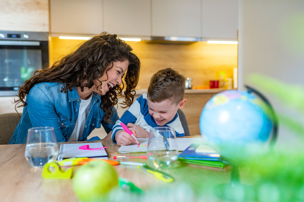 Female caregiver providing care for young male
