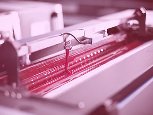 a printing machine ready with pink ink showing