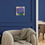 Thumbnail: Thistle (2) 2024 Painting displayed on a dark blue wall above a chair in a lounge