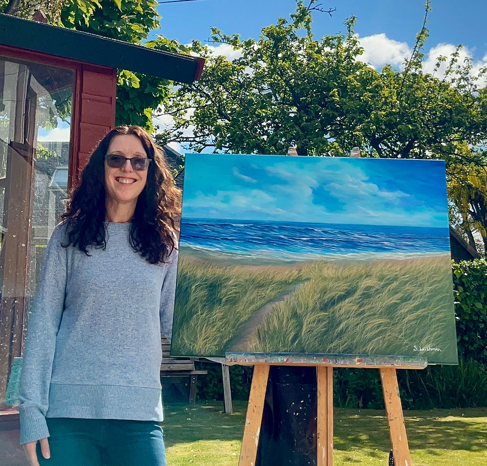 Thumbnail: Artist Susan Leishman standing next to the original acrylic painting Ayrshire Dunes, Scotland a coastal seascape.