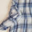 Thumbnail: M&S blue check blouse with ruffled front. Size 12