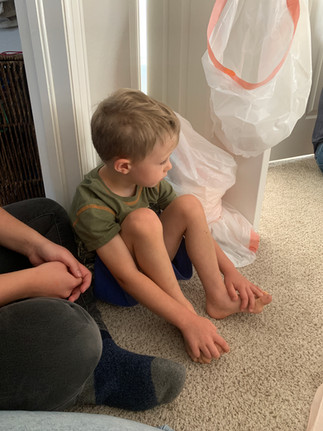 older sibling waiting on his brother to be born at home