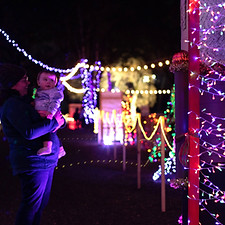 Lights of Hope Mother and child in christmas light tunnel