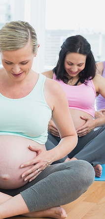 Pregnant women in yoga