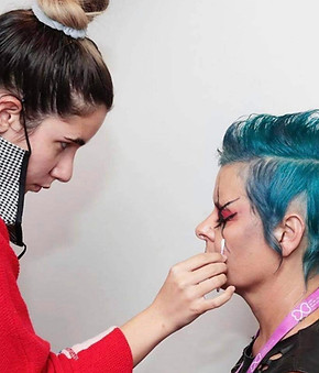 Paige doing makeup on a client