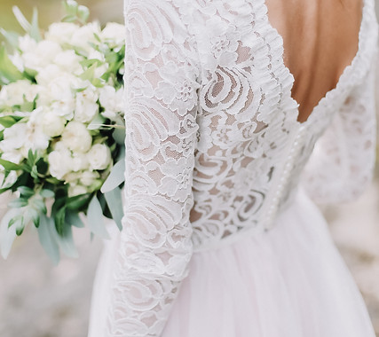 Bride holds a wedding bouquet, wedding dress, wedding details.jpg