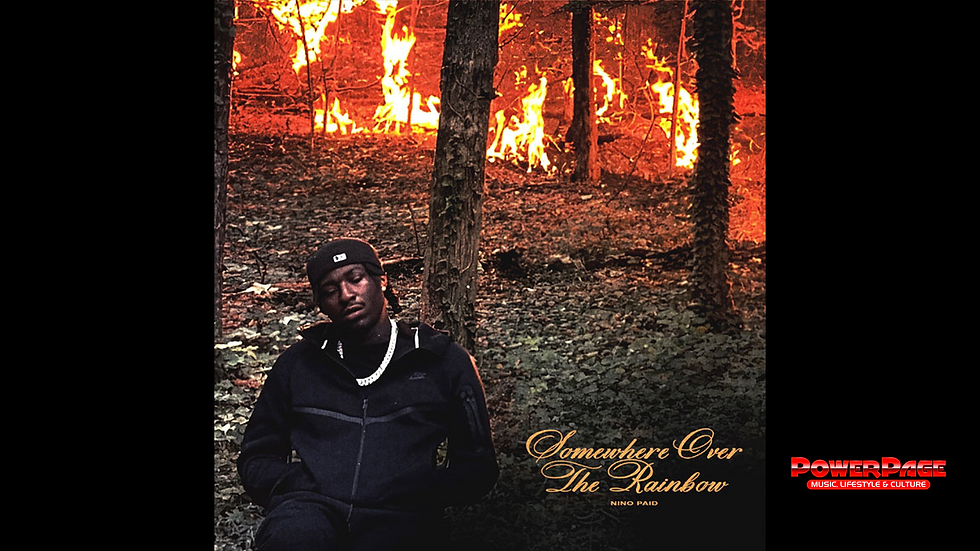 Nino Paid appears in the official Somewhere Over the Rainbow album artwork against a burning woodland backdrop.