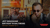 Tom Browne and Jeff Bradshaw pose side by side with brass instruments in front of a warm indoor background.