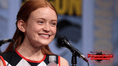 Sadie Sink speaking at San Diego Comic-Con in 2017. Photo by Gage Skidmore via Wikimedia Commons, CC BY-SA 3.0; cropped and branded for PowerPage.