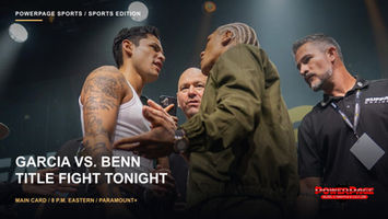 Ryan Garcia and Conor Benn face off onstage with event personnel nearby.