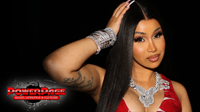 Cardi B in a red outfit and diamond jewelry in a PowerPage editorial image.