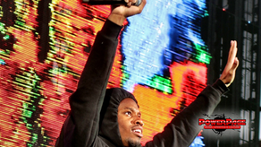 Denzel Curry performing at Red Rocks with the official PowerPage logo.