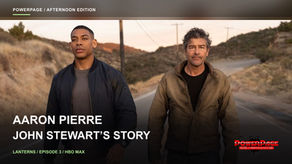 Aaron Pierre, wearing a dark jacket, and Kyle Chandler, in a brown jacket, walk side by side on a rural road in “Lanterns.”