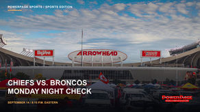 Fans and tailgate tents fill the parking area outside Arrowhead Stadium.