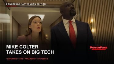 Rachel Keller and Mike Colter stand in a wood-paneled office with both complete heads visible