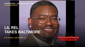 Lil Rel Howery smiling in a dark jacket against a neutral backdrop
