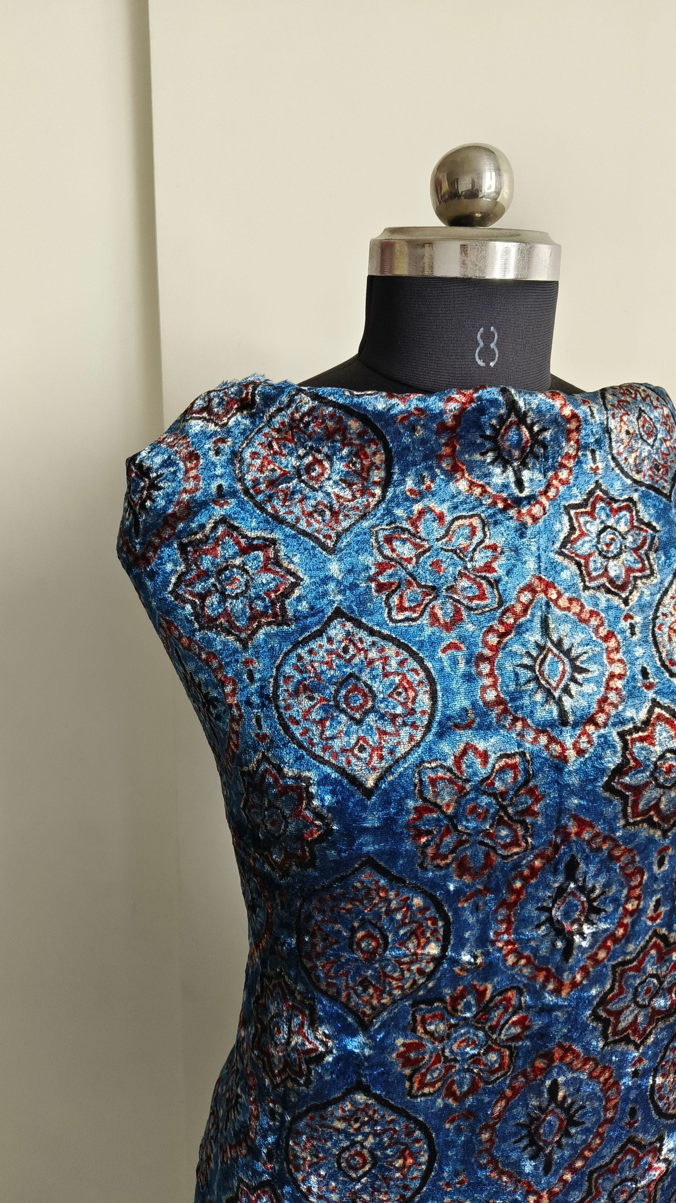 Close-up of indigo badaam Ajrakh handblock print on velvet kurta fabric