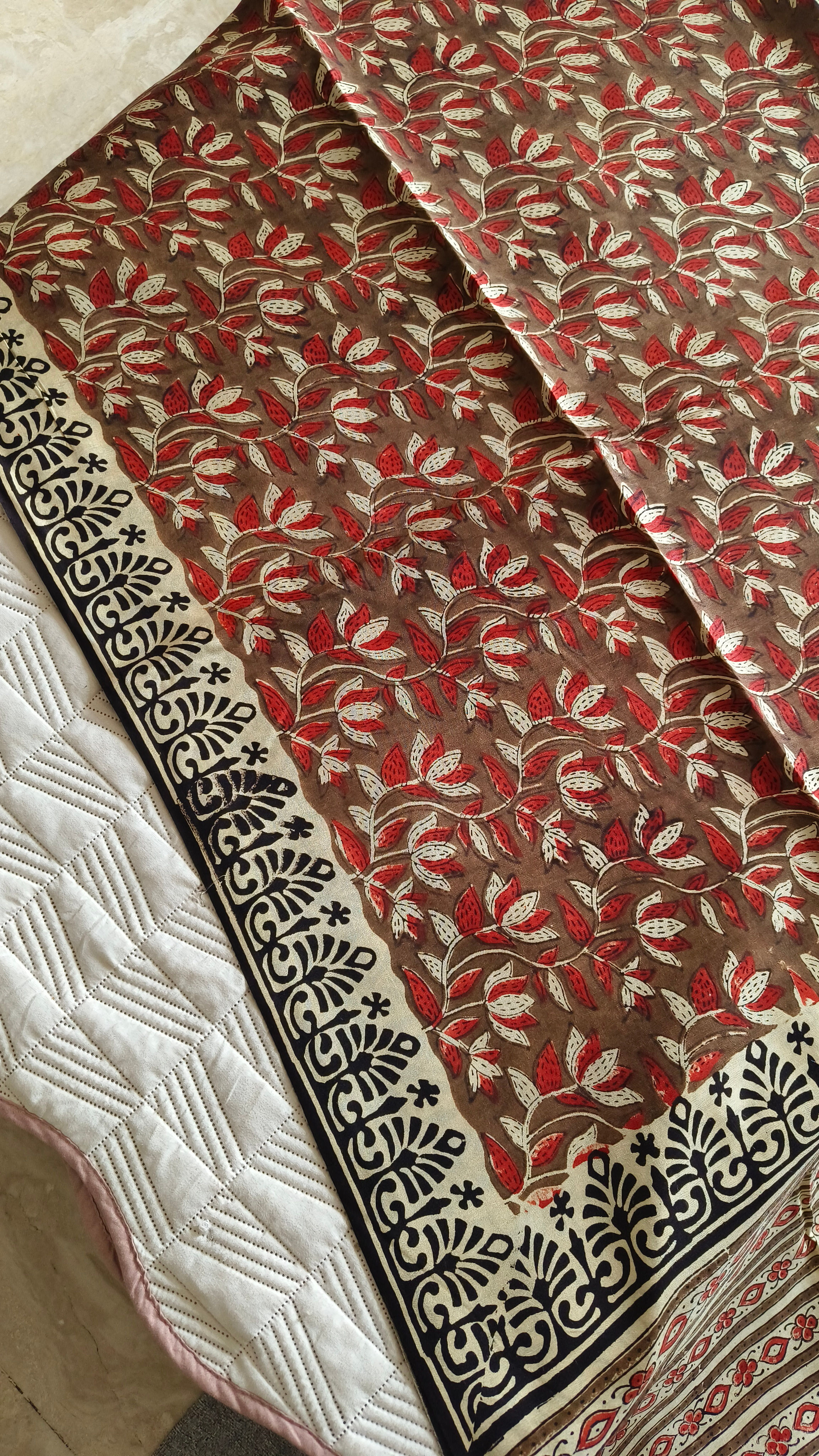 Close-up of Vanaspati handblock rustic brown motifs on lightweight modal silk saree
