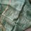 Thumbnail: Blouse detail complementing dusty pastel green muslin silk saree